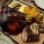 Platter of smoked half pig head with fritto misto, onions, brains, ears, tongue, loin, and coppa.